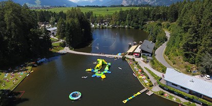 Luxuscamping - Gartenmöbel - Region Innsbruck - Mega-Aqua Park - Nature Resort Natterer See Safari-Lodge-Zelt "Rhino" am Nature Resort Natterer See