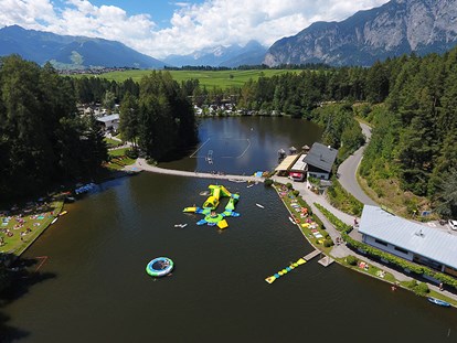 Luxuscamping - Parkplatz bei Unterkunft - Österreich - Mega-Aqua Park - Nature Resort Natterer See Wood-Lodges am Nature Resort Natterer See