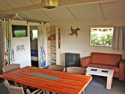 Luxuscamping - Heizung - Niederlande - Wohnraum - Camping De Kleine Wolf Oehoe Lodge auf Campingplatz de Kleine Wolf
