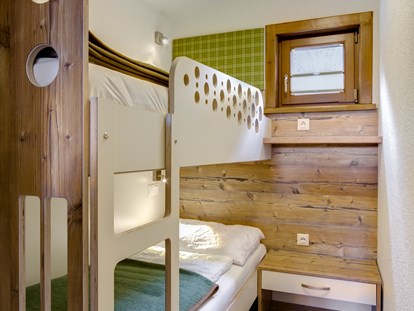 Luxuscamping - getrennte Schlafbereiche - Chalet Kinderzimmer - Camping Brunner am See Chalets auf Camping Brunner am See