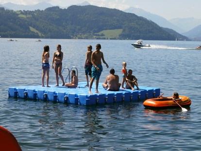 Luxuscamping - Geschirrspüler - Schwimmplattform Camping Brunner - Camping Brunner am See Chalets auf Camping Brunner am See