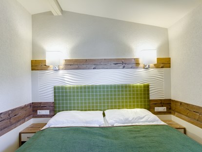 Luxuscamping - getrennte Schlafbereiche - Chalet Schlafzimmer - Camping Brunner am See Chalets auf Camping Brunner am See