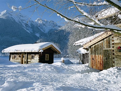 Luxuscamping - Art der Unterkunft: Hütte/POD - Tiroler Unterland - Wintertraum im Almdorf Grubhof - Grubhof Almhütte Almberg Alm im Almdorf Grubhof