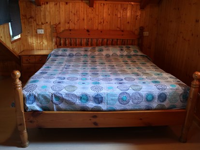 Luxuscamping - Art der Unterkunft: Bungalow - Montorfano - Doppelbett im Bungalow auf Camping Montorfano  - Camping Montorfano Bungalows
